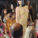 Emerging fashion designer presenting their debut collection at a USMI creative arts event in Miami