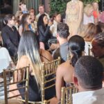 Live fashion styling performance at a USMI community event in Miami Beach